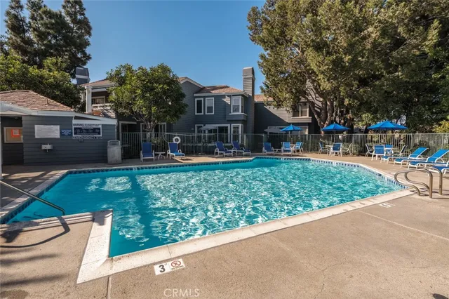 a city view with tall buildings and a yard