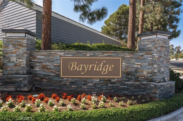 a sign broad in front of flowers