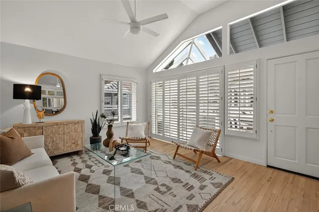 a view of a livingroom with furniture and a window