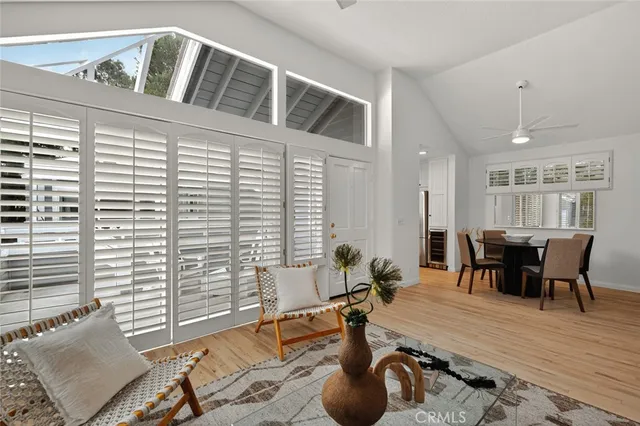 a view of a livingroom with furniture and a window