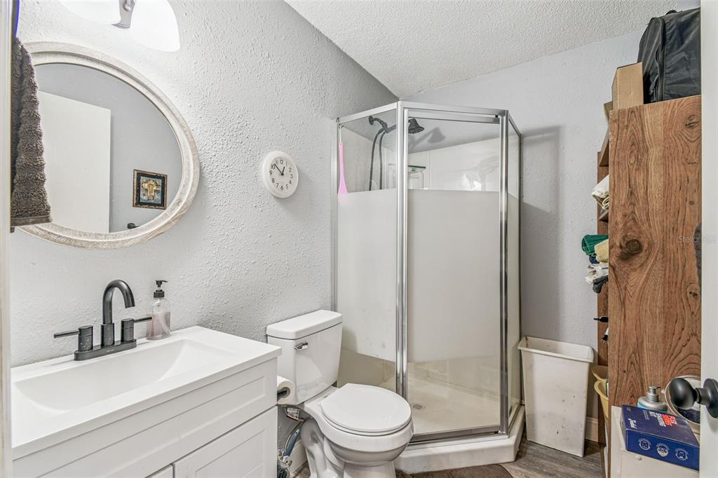 1317 Carl Street Inverness, FL 34453 - Photo 11 of 20 a white toilet sitting next to a bathroom sink