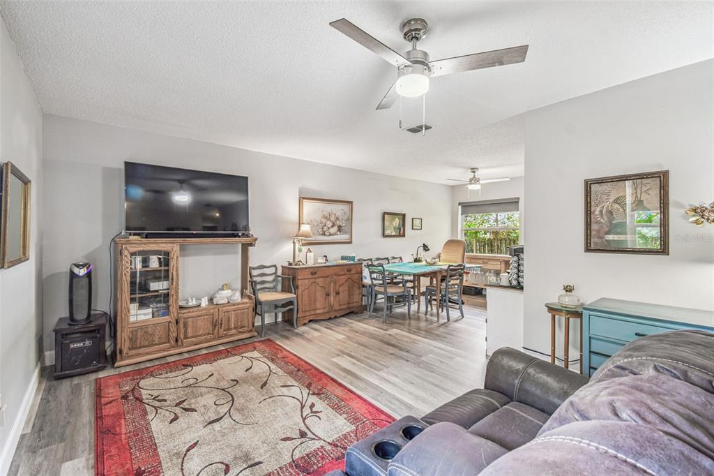 1317 Carl Street Inverness, FL 34453 - Photo 5 of 20 a living room with furniture and a flat screen tv