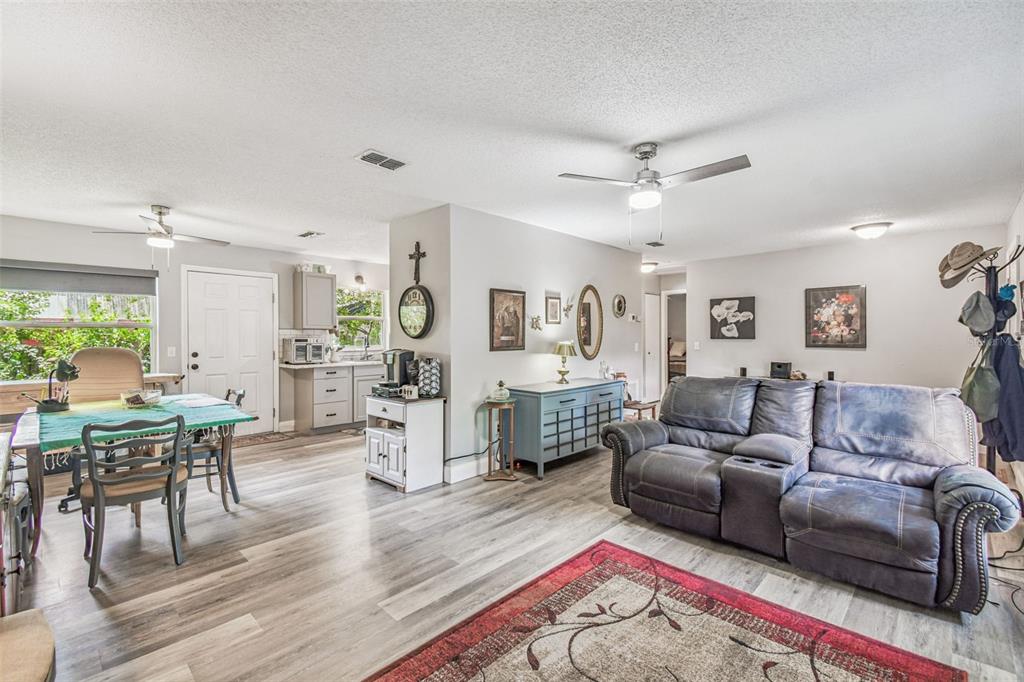 1317 Carl Street Inverness, FL 34453 - Photo 6 of 20 a living room with furniture and view of kitchen