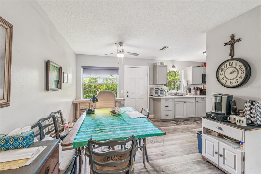 1317 Carl Street Inverness, FL 34453 - Photo 7 of 20 a view of a dining room with furniture and a clock