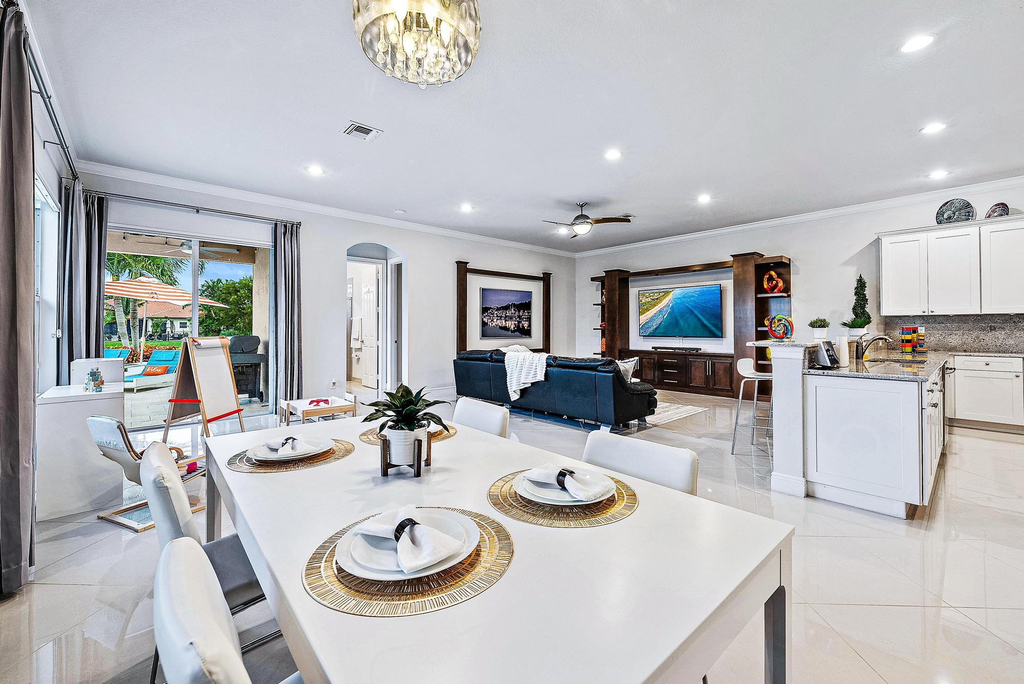 127 Steeple Circle Jupiter, FL 33458 - Photo 14 of 56 a open dining room with furniture and a kitchen view