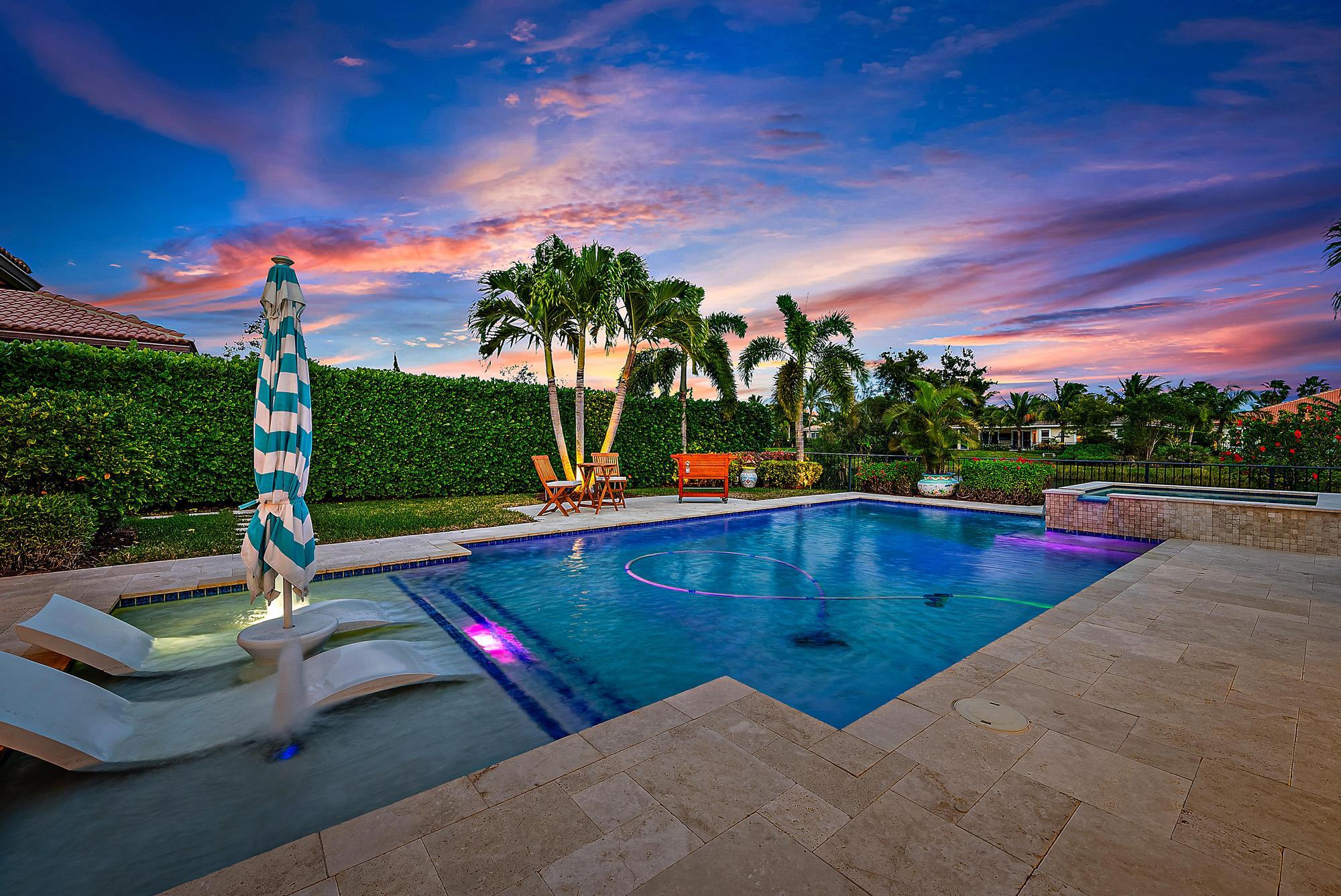 127 Steeple Circle Jupiter, FL 33458 - Photo 3 of 56 a view of a swimming pool with a yard