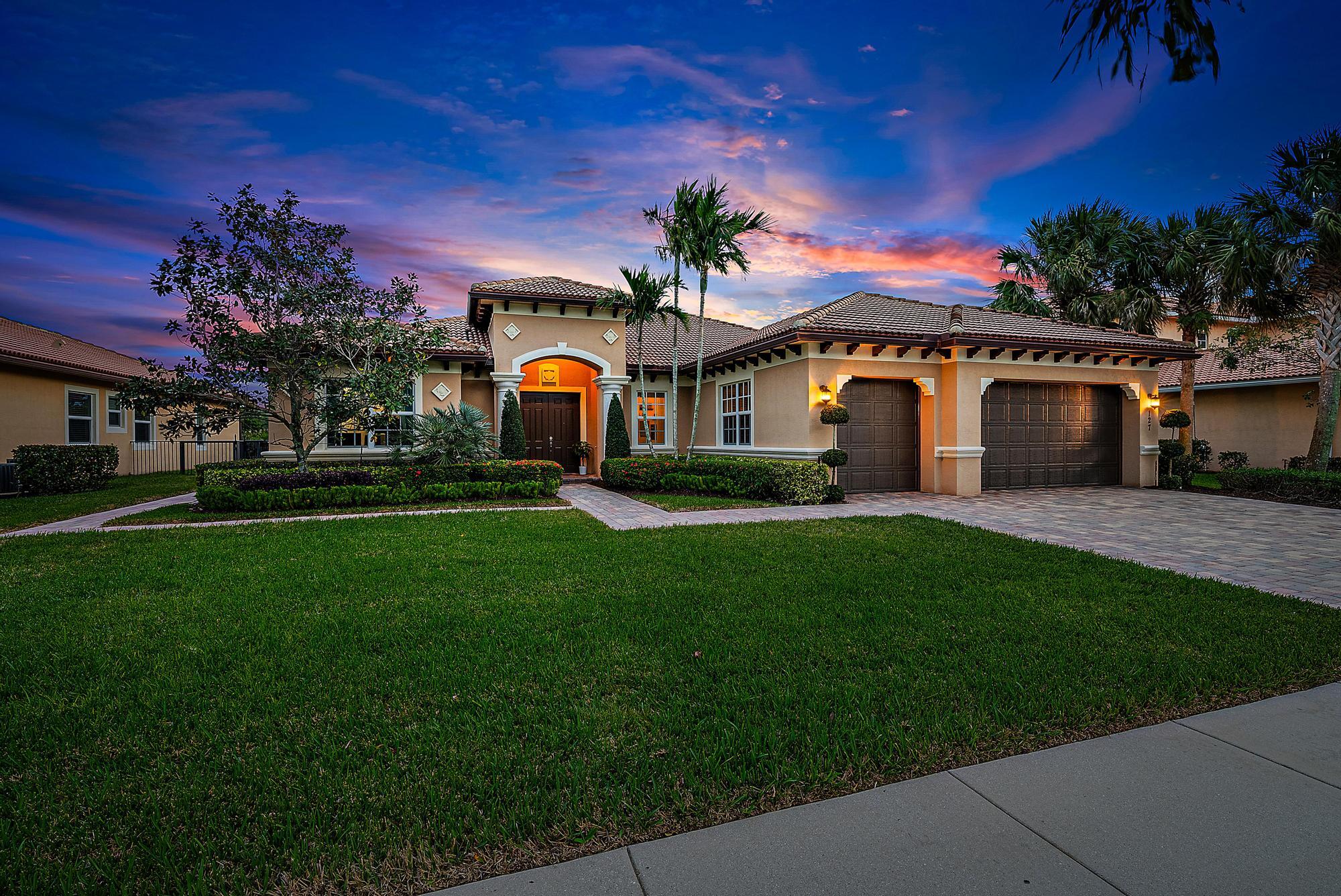 127 Steeple Circle Jupiter, FL 33458 - Photo 33 of 56 a front view of house with yard and green space