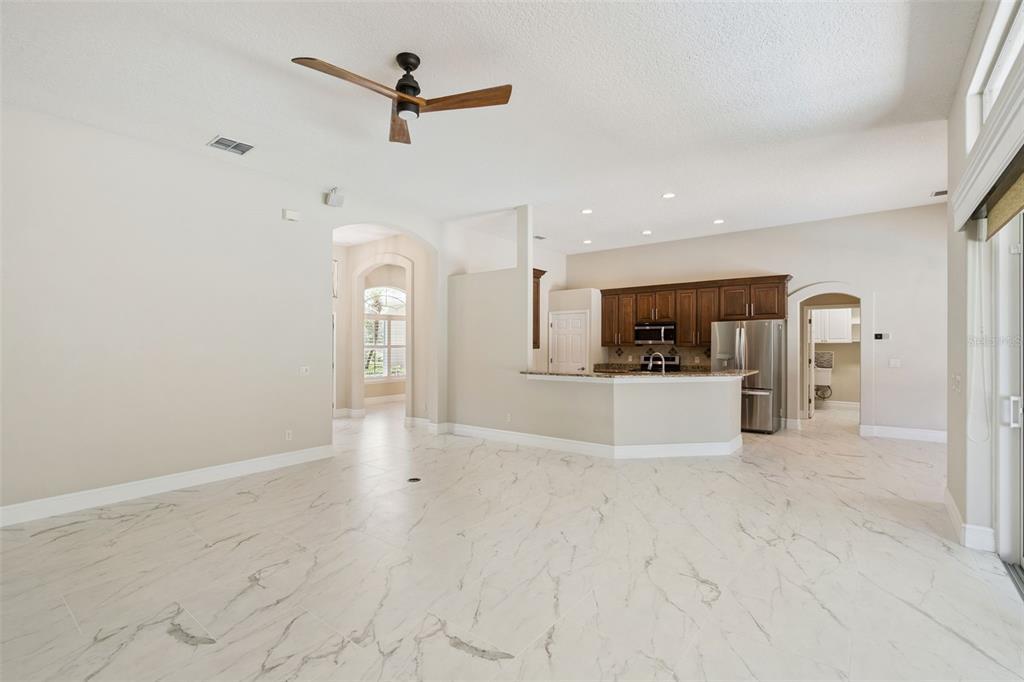 2230 Ridgewind Way Windermere, FL 34786 - Photo 12 of 38 a view of a kitchen with a sink and a refrigerator