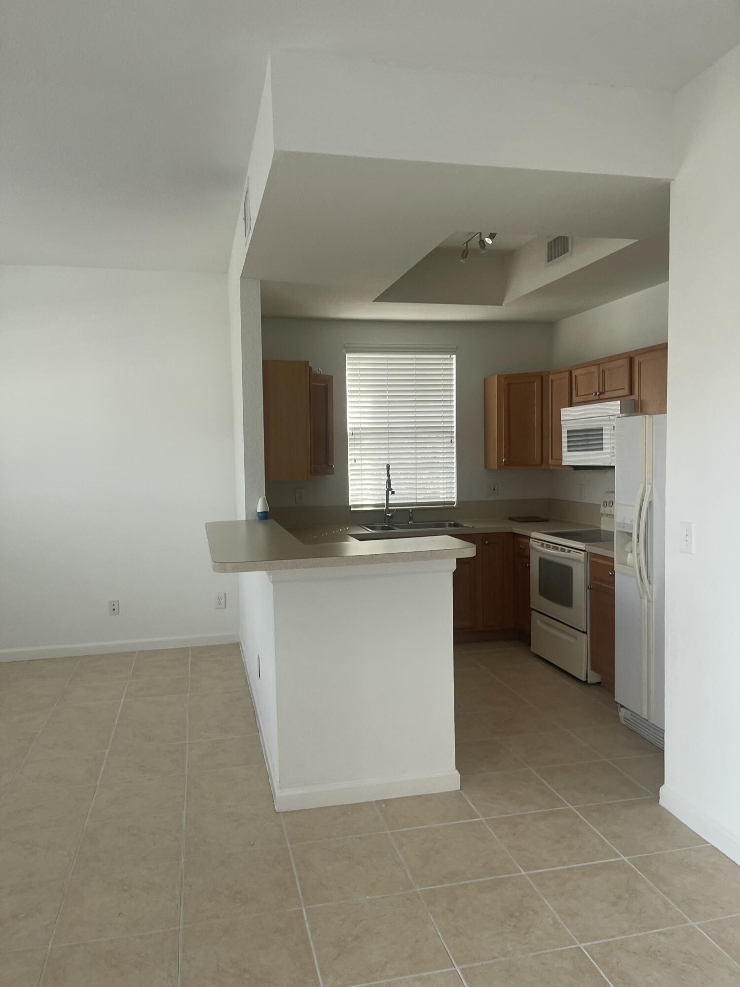 10440 Southwest Stephanie Way, Unit 211 Port St. Lucie, FL 34987 - Photo 4 of 13 IMG_2900