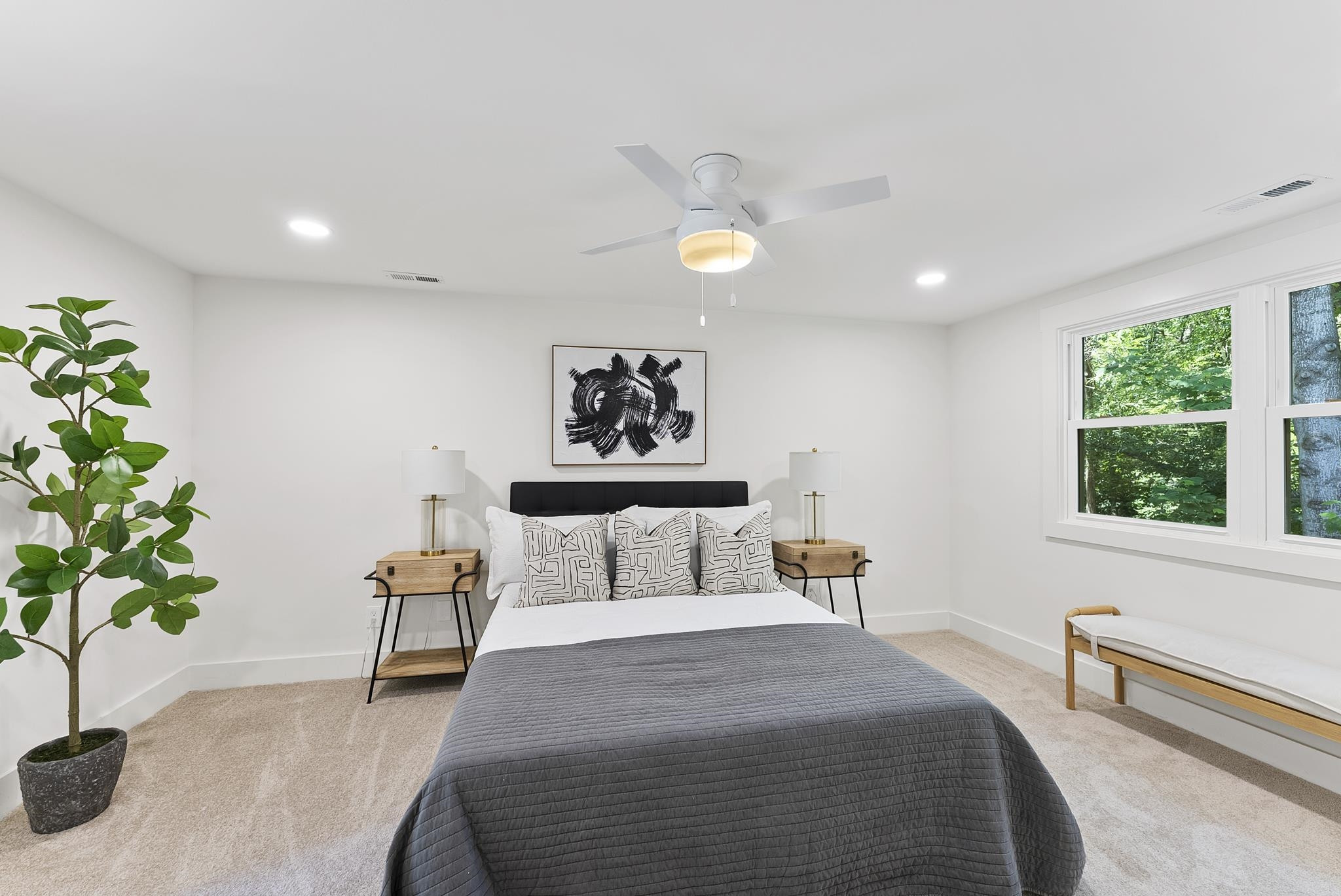 7604 Filgate Court Raleigh, NC 27615 - Photo 19 of 34 a bedroom with a bed and a potted plant