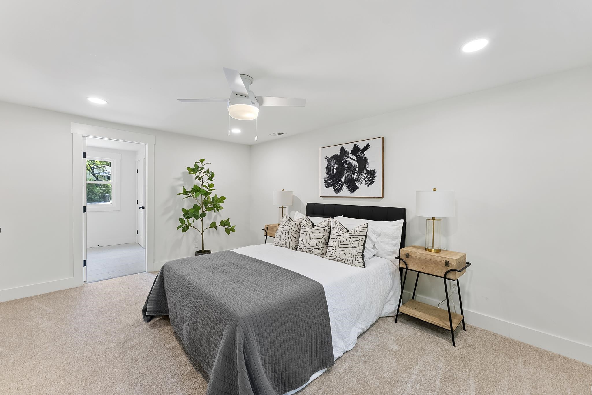 7604 Filgate Court Raleigh, NC 27615 - Photo 20 of 34 a bedroom with a bed and a chandelier