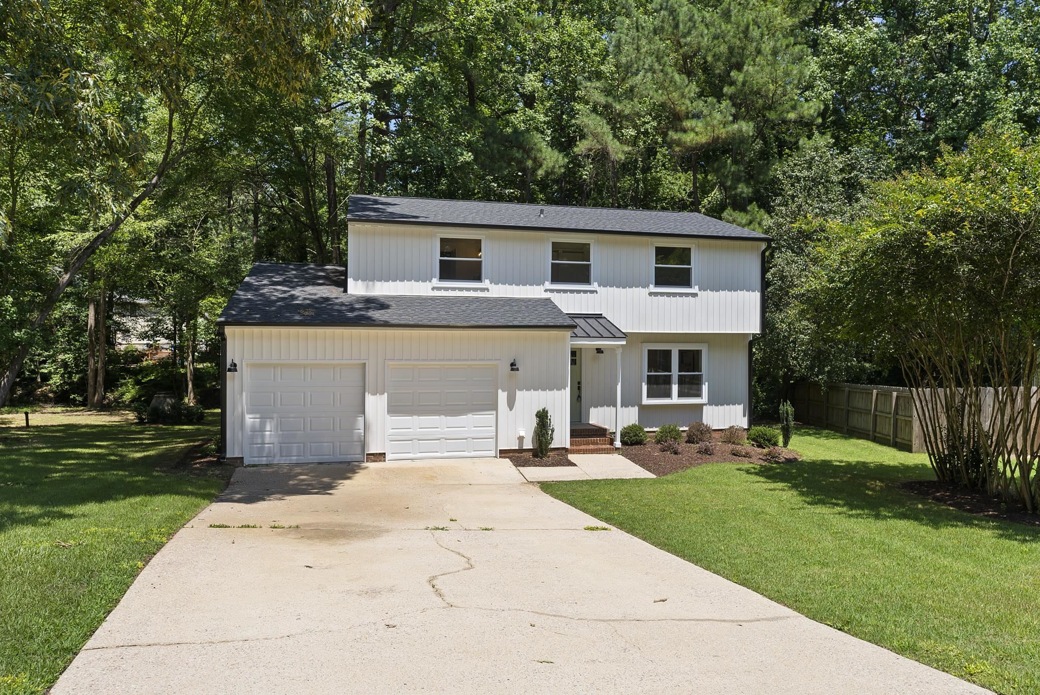 7604 Filgate Court Raleigh, NC 27615 - Photo 2 of 34 a view of a house with a yard and sitting area