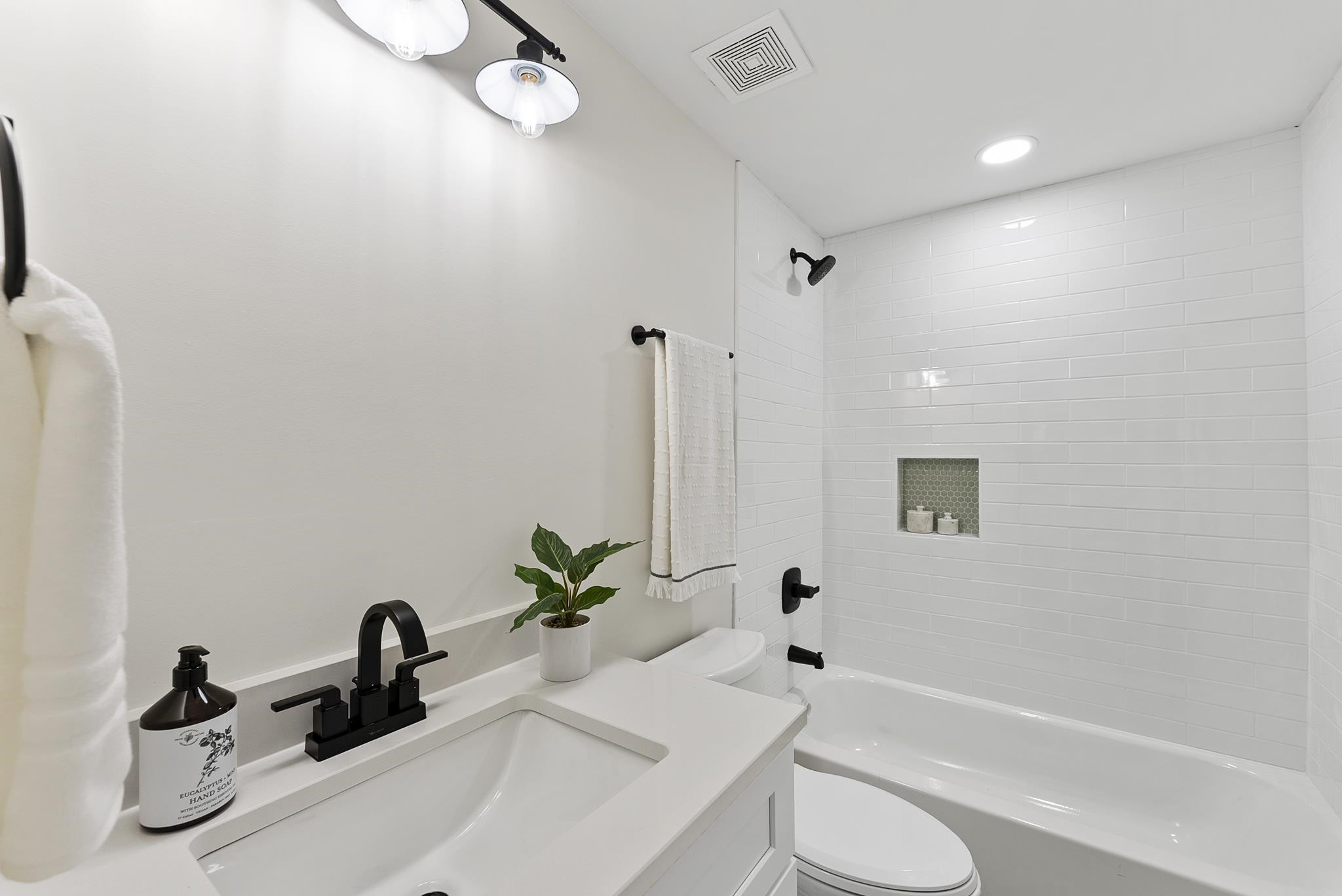 7604 Filgate Court Raleigh, NC 27615 - Photo 26 of 34 a bathroom with a sink a toilet and shower