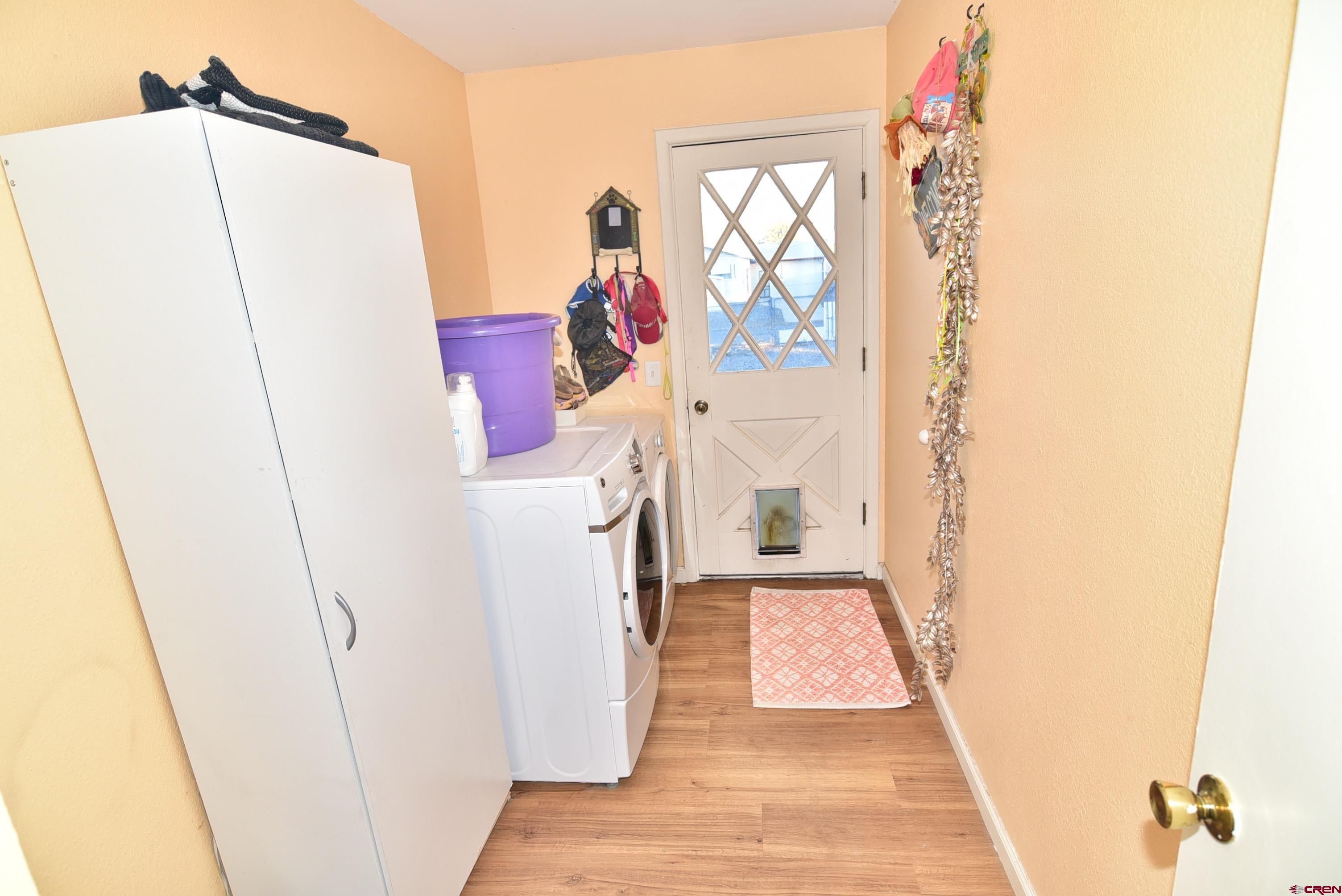 114 Cedar Street Delta, CO 81416 - Photo 14 of 31 a view of hallway with window and stairs