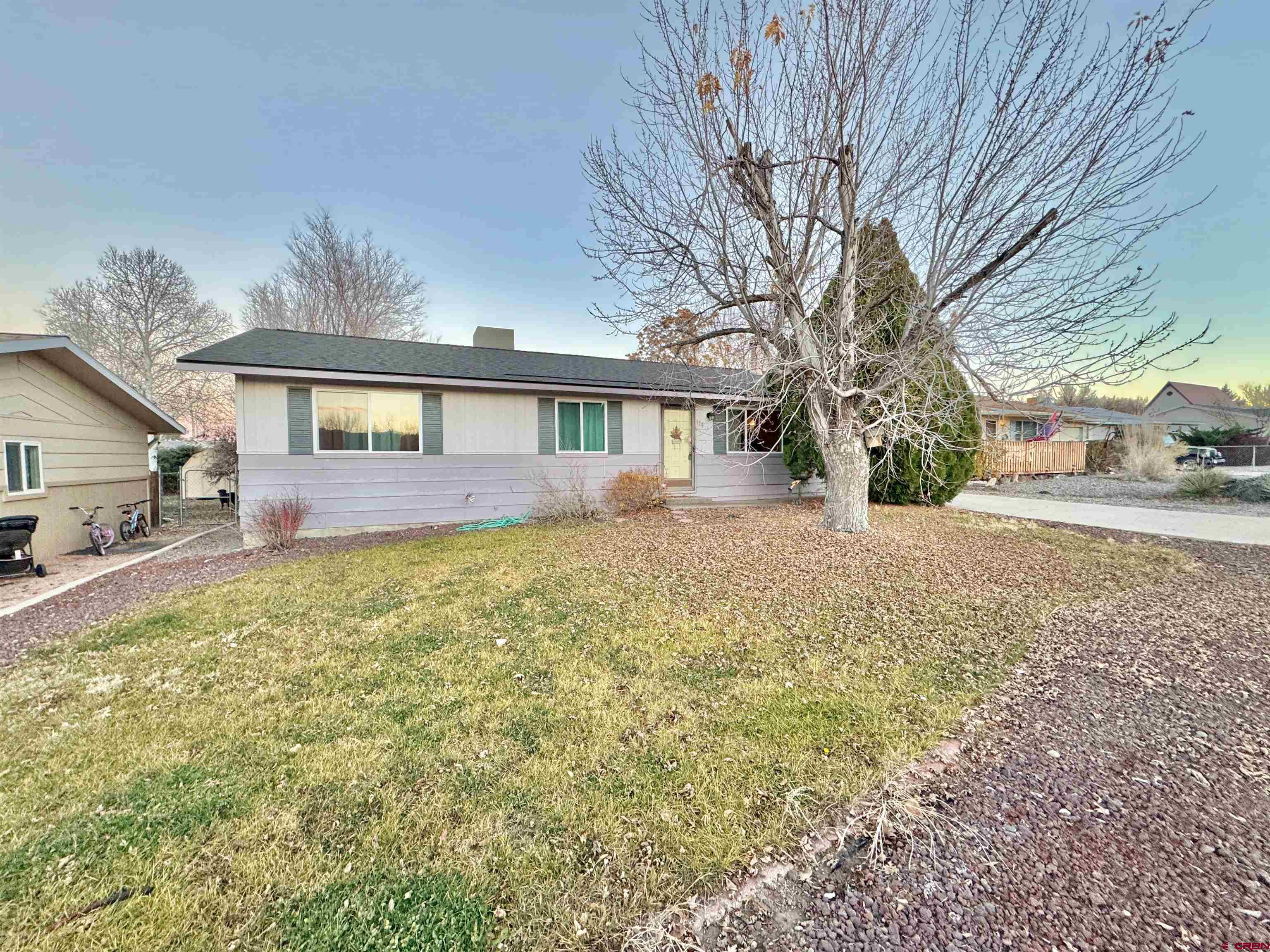114 Cedar Street Delta, CO 81416 - Photo 2 of 31 a front view of house with yard