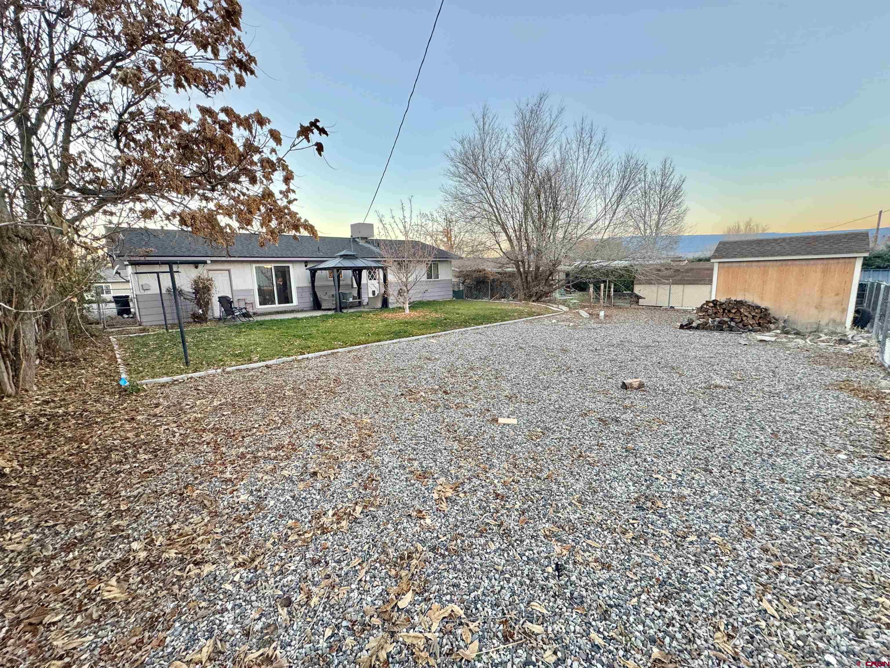 114 Cedar Street Delta, CO 81416 - Photo 22 of 31 a view of a house with a yard