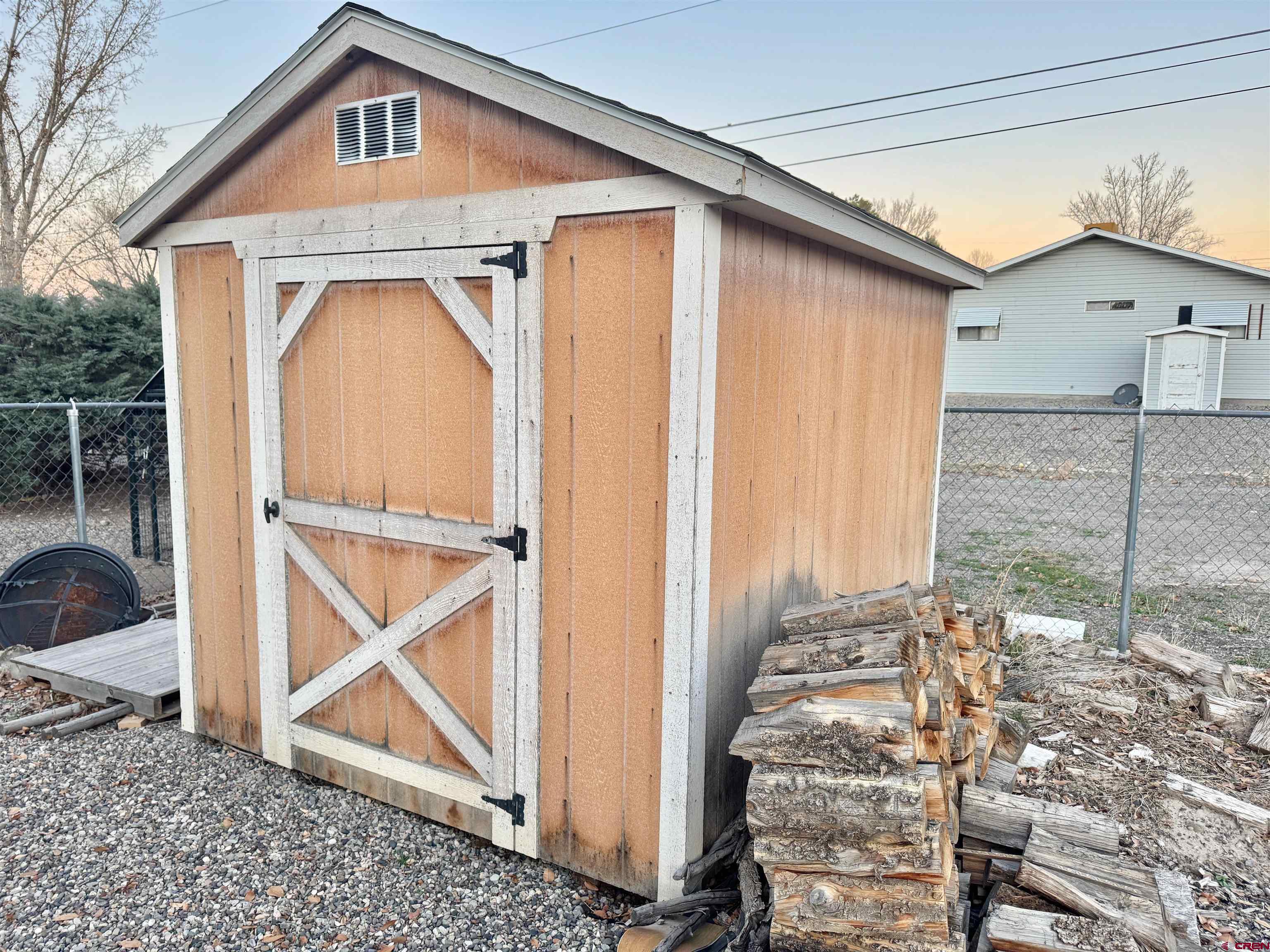 114 Cedar Street Delta, CO 81416 - Photo 23 of 31 a front view of a house with white fence