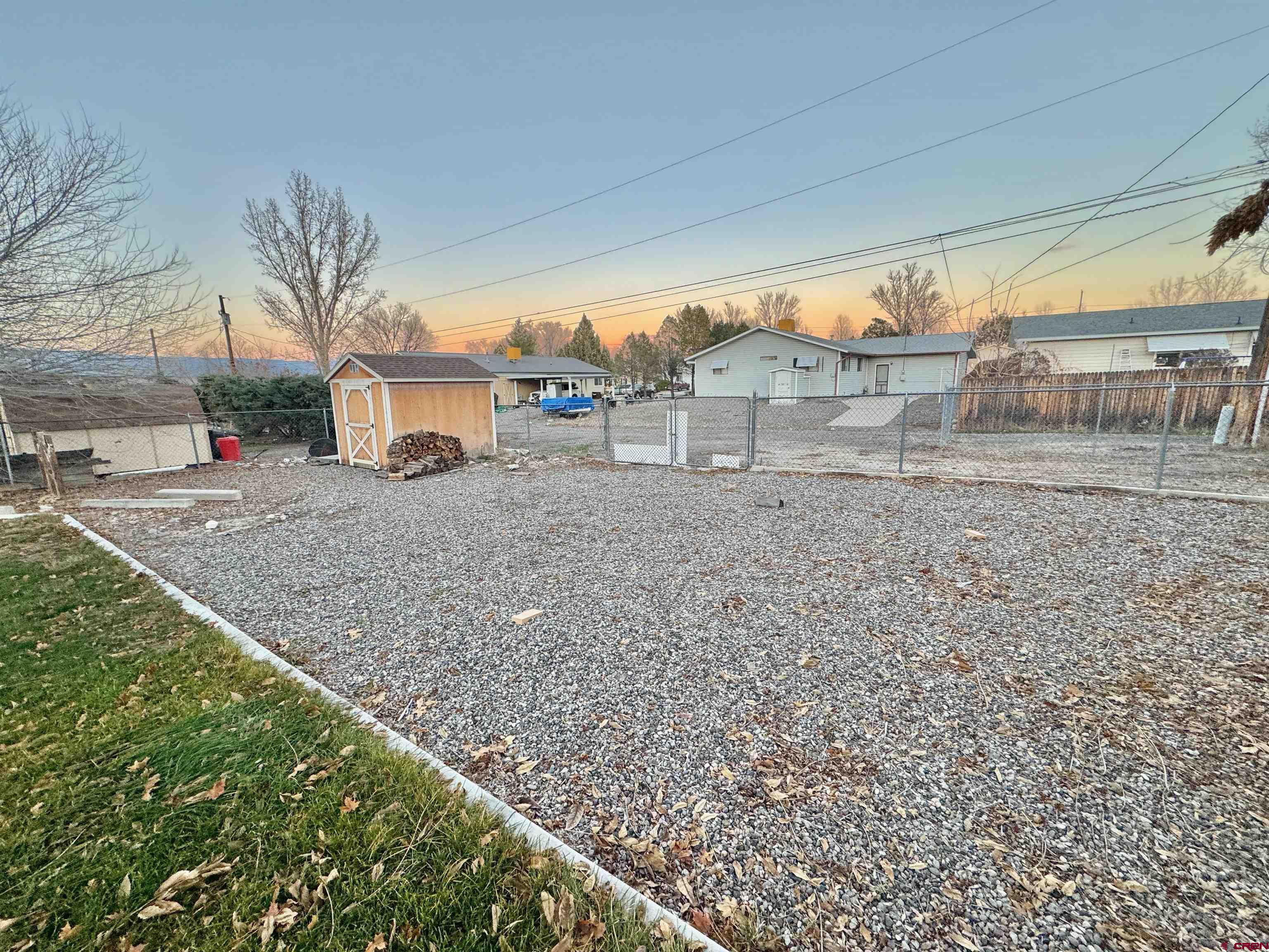 114 Cedar Street Delta, CO 81416 - Photo 26 of 31 a view of a dirt road and a building