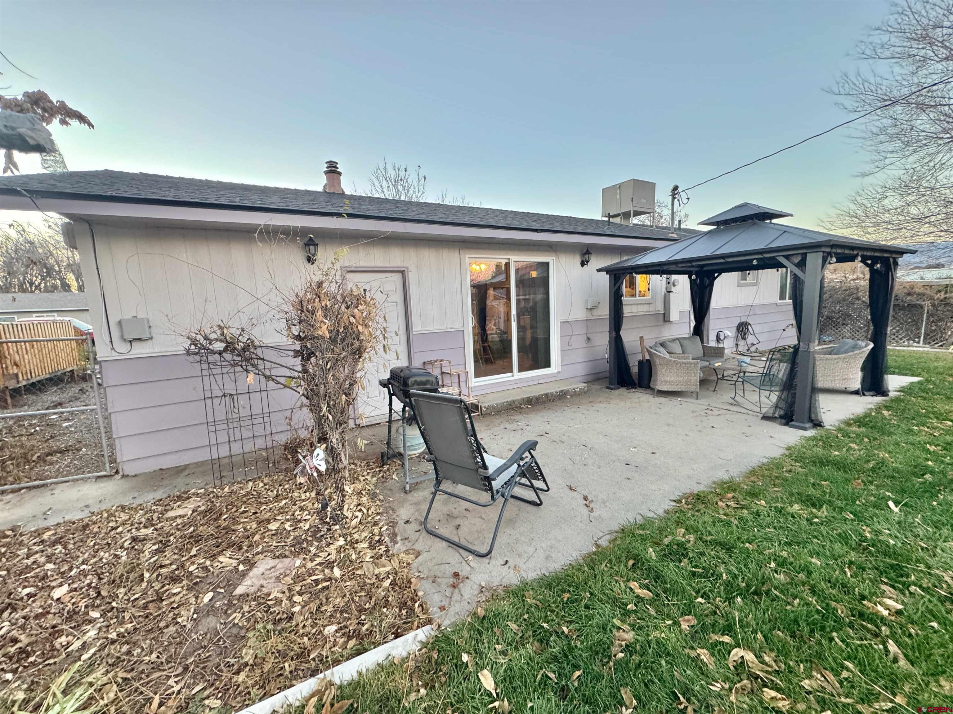 114 Cedar Street Delta, CO 81416 - Photo 28 of 31 a view of a patio with furniture and a yard