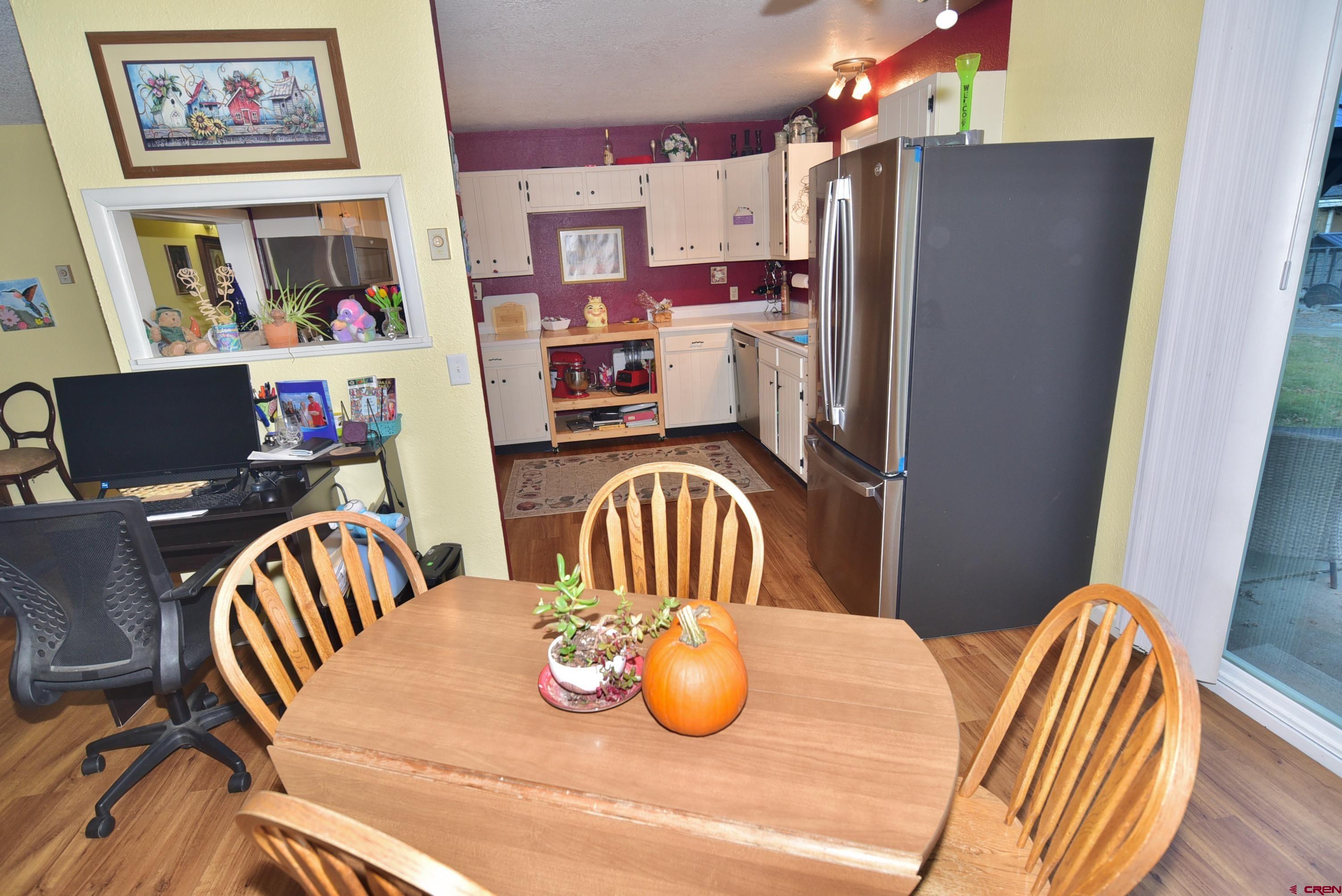 114 Cedar Street Delta, CO 81416 - Photo 10 of 31 a bedroom with furniture and a chair