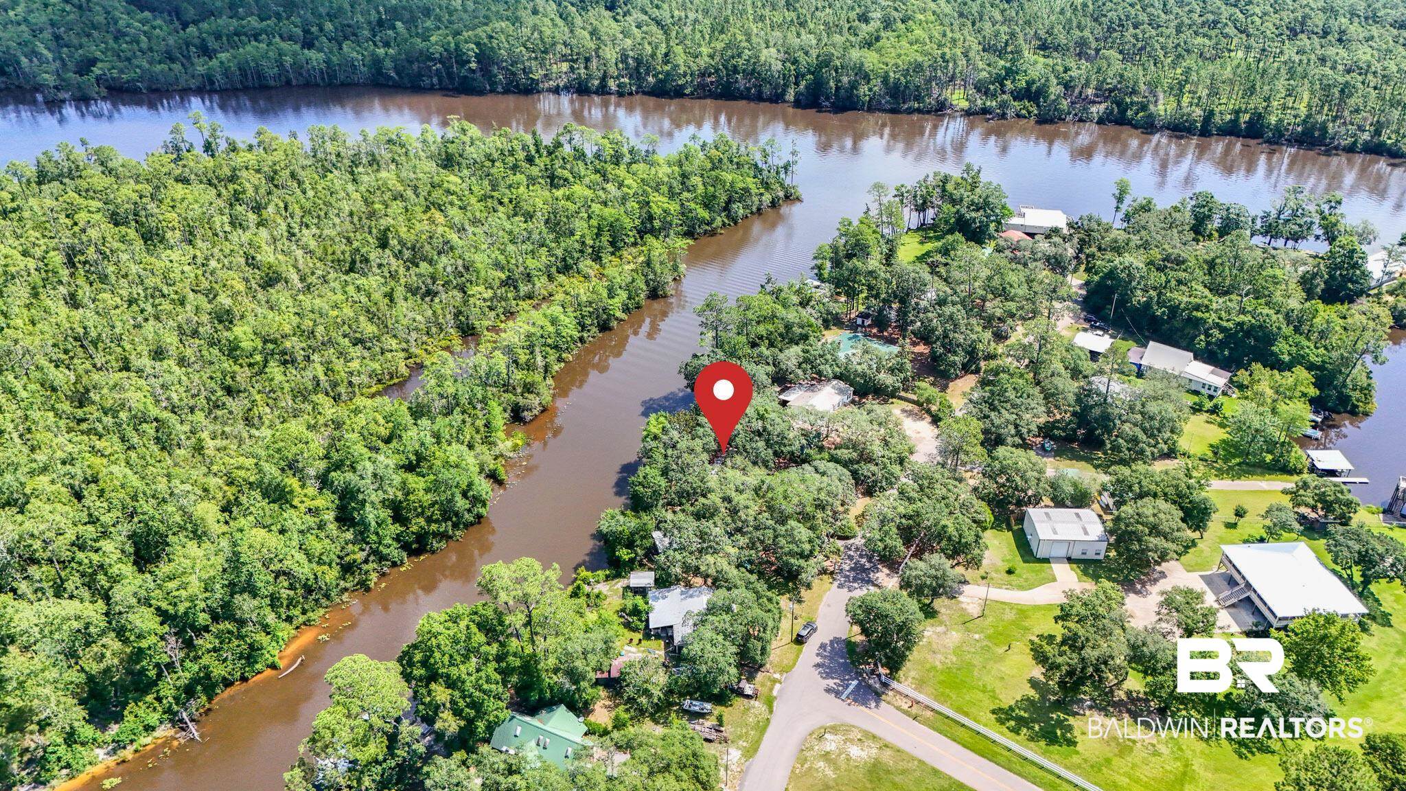 34341 Lost River Road Seminole, AL 36574 - Photo 34 of 36 Aerial view of a heavily wooded area and a large body of water