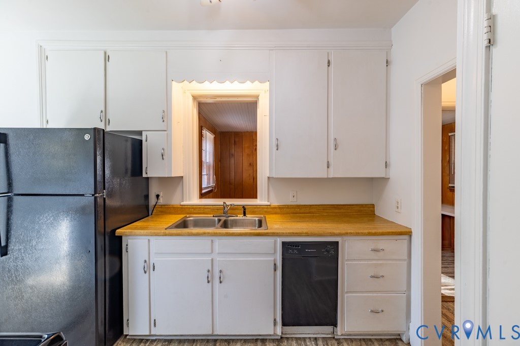 106 Courthouse Road Blackstone, VA 23824 - Photo 10 of 27 a kitchen with a refrigerator and a sink