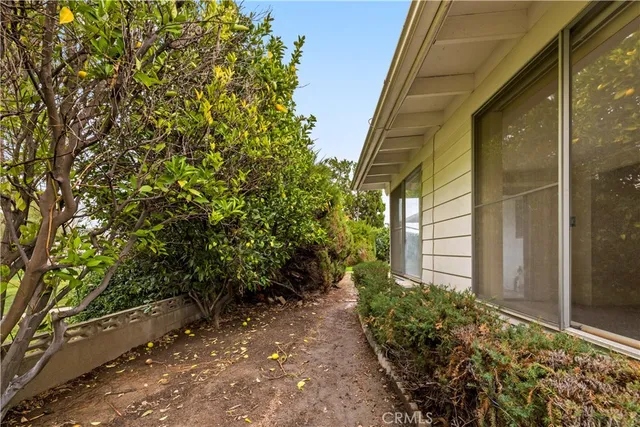 a backyard of a house with lots of green space