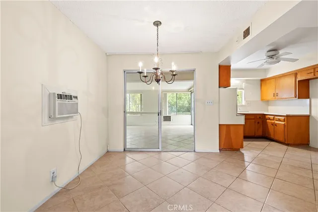 a view of a kitchen with a sink and a refrigerator windows