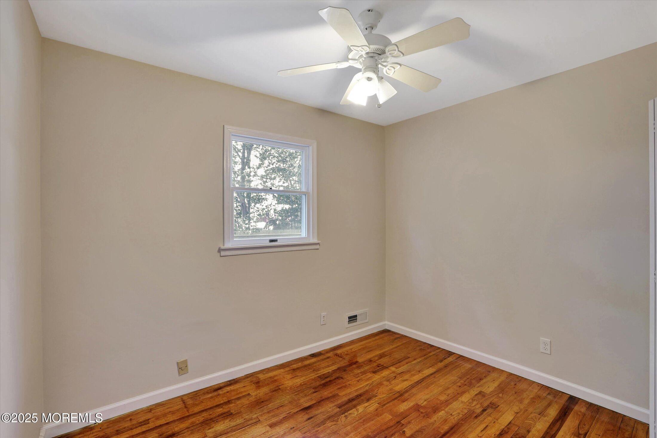 23 Princeton Drive Howell, NJ 07731 - Photo 12 of 32 an empty room with a window