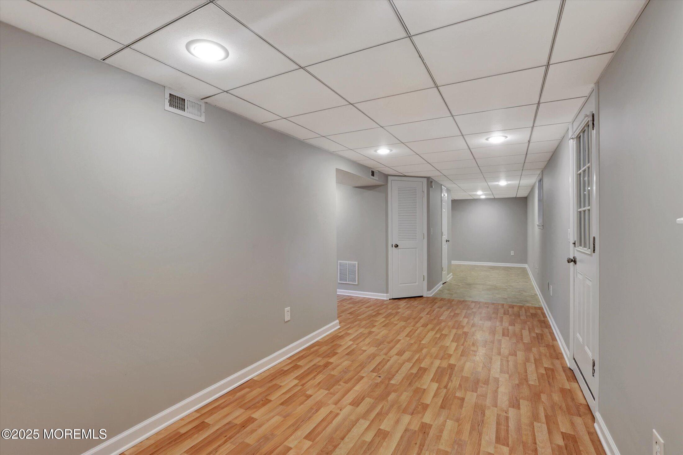 23 Princeton Drive Howell, NJ 07731 - Photo 17 of 32 a view of empty room with wooden floor