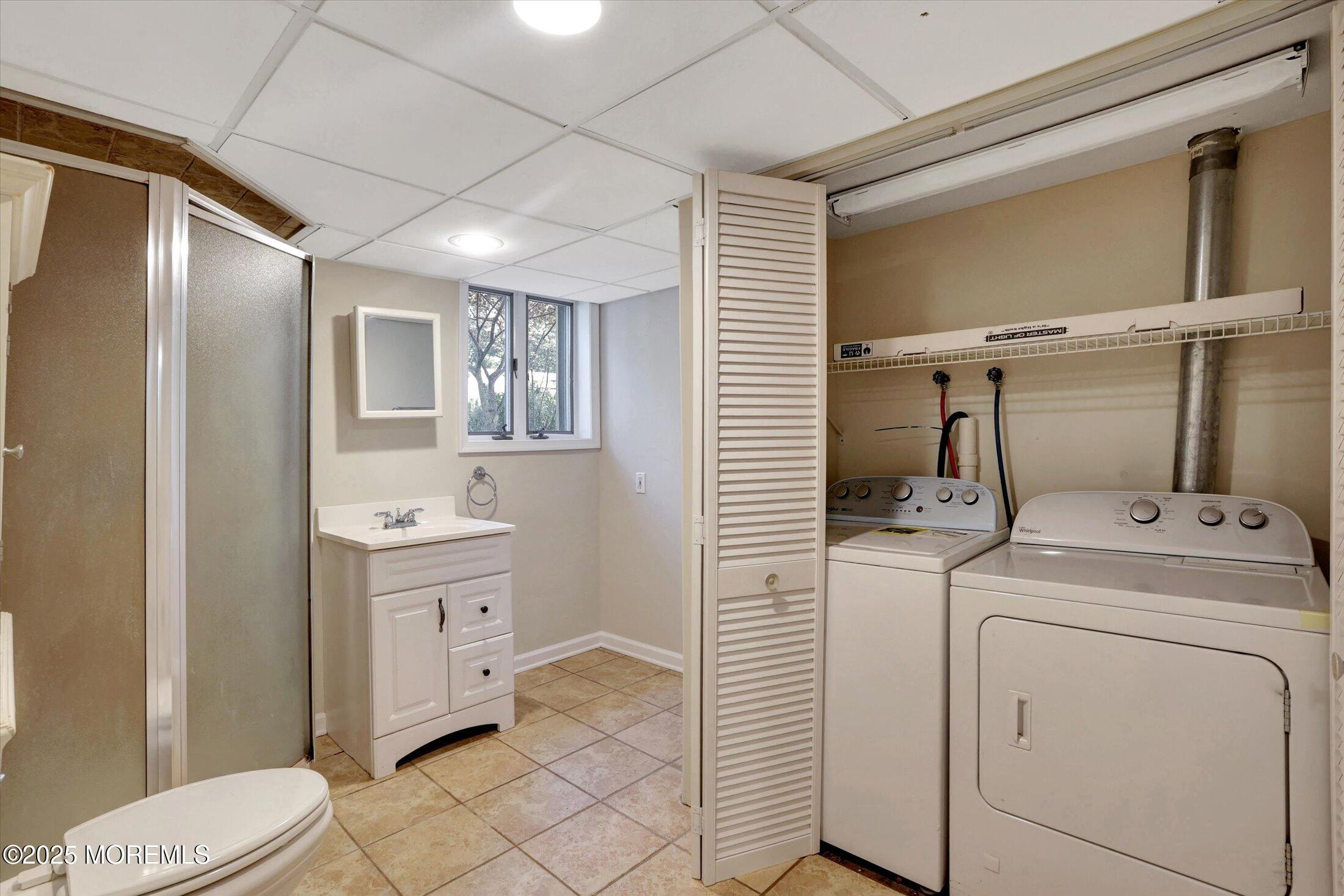 23 Princeton Drive Howell, NJ 07731 - Photo 22 of 32 a view of bathroom with a washer and dryer