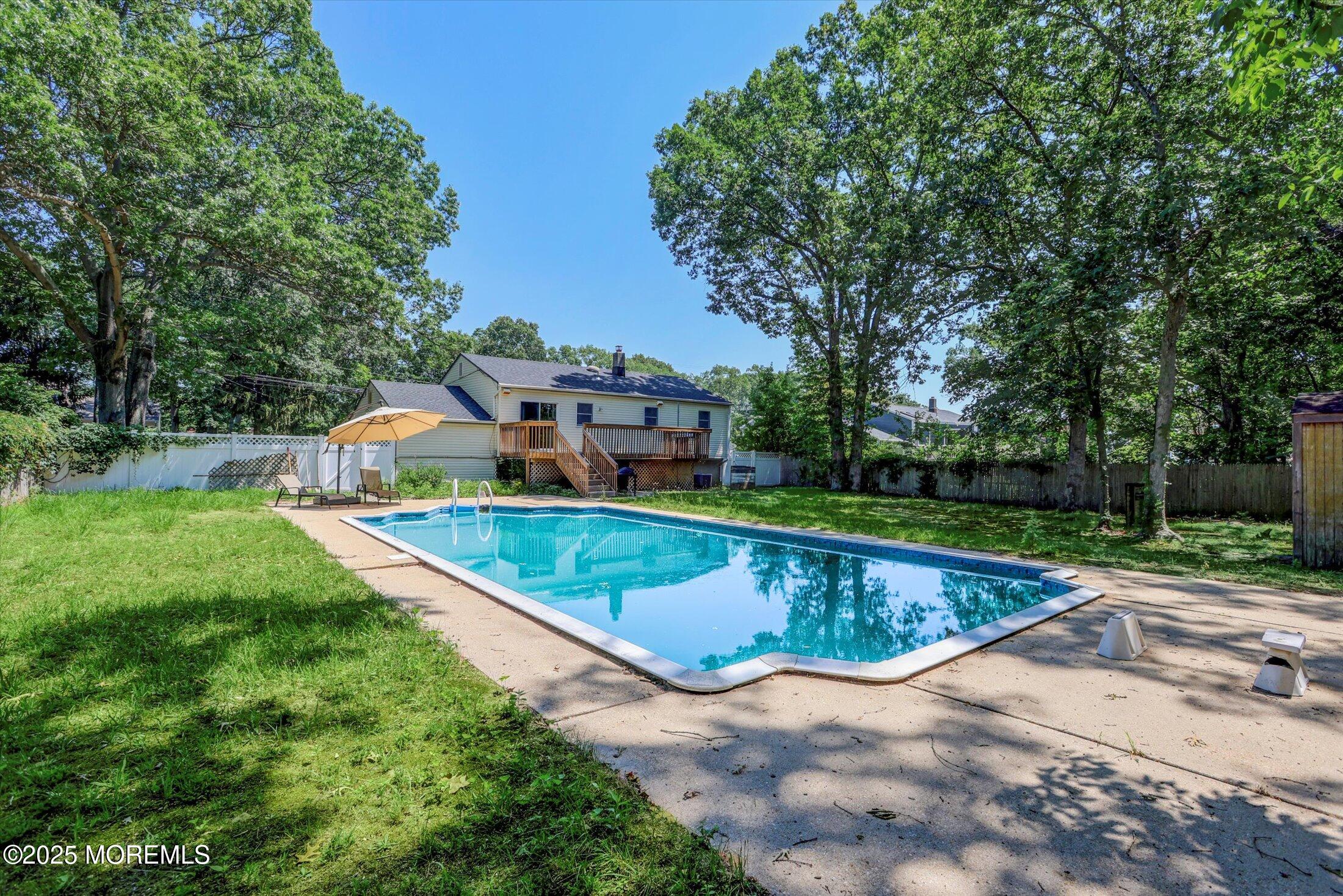 23 Princeton Drive Howell, NJ 07731 - Photo 23 of 32 a view of a swimming pool with a yard