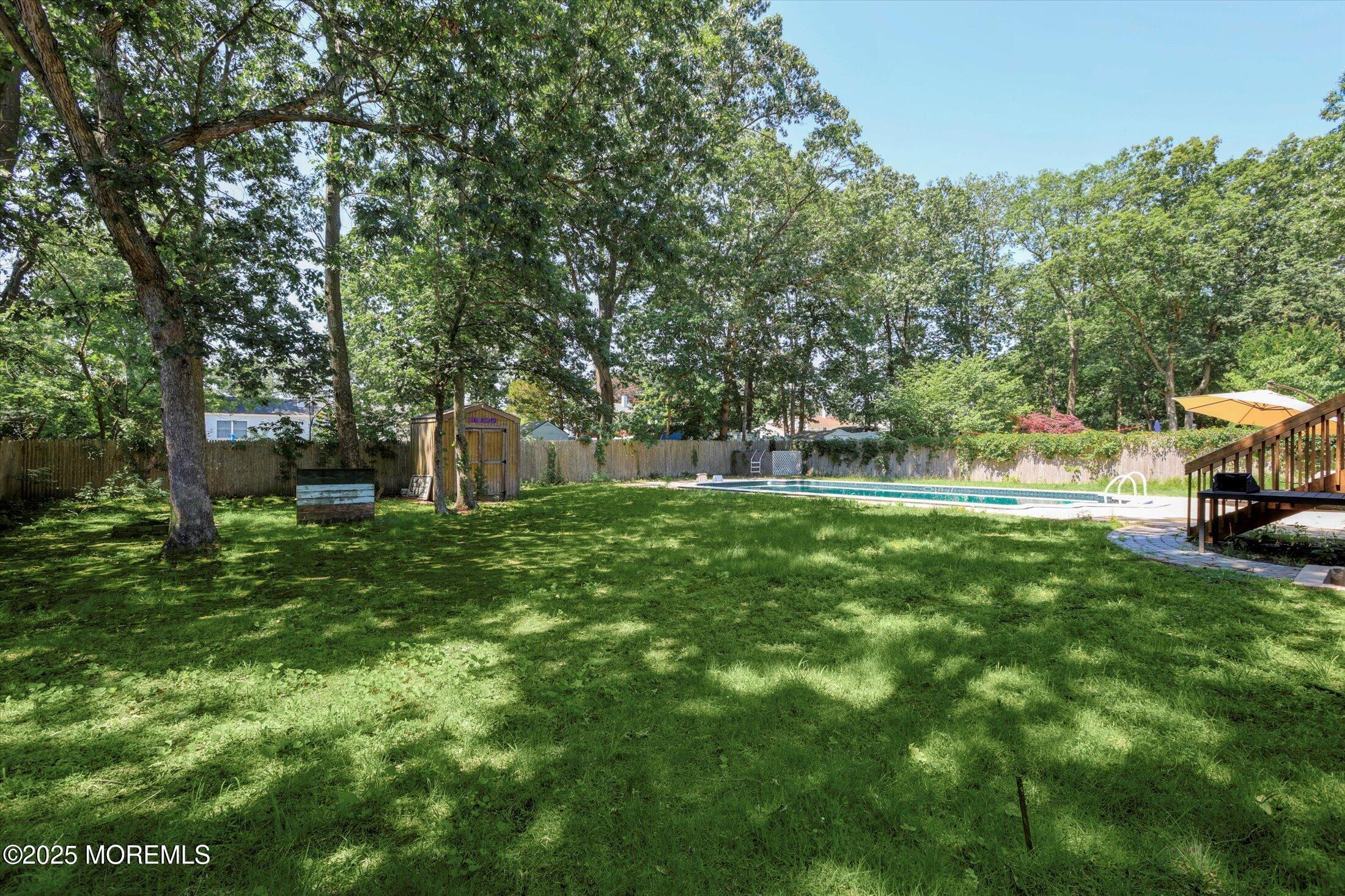23 Princeton Drive Howell, NJ 07731 - Photo 30 of 32 a view of a house with backyard and sitting area