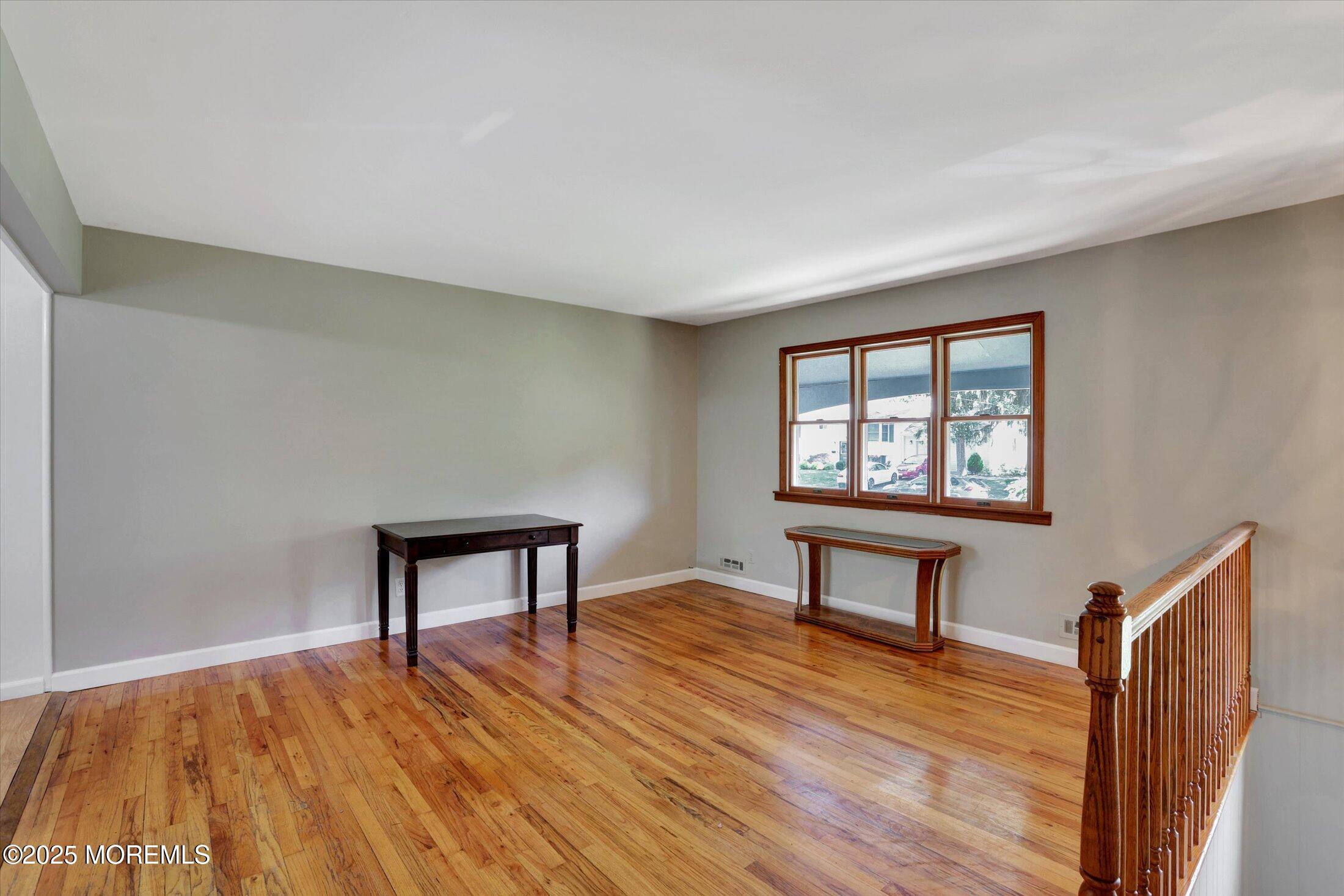 23 Princeton Drive Howell, NJ 07731 - Photo 3 of 32 a view of a livingroom with furniture and wooden floor