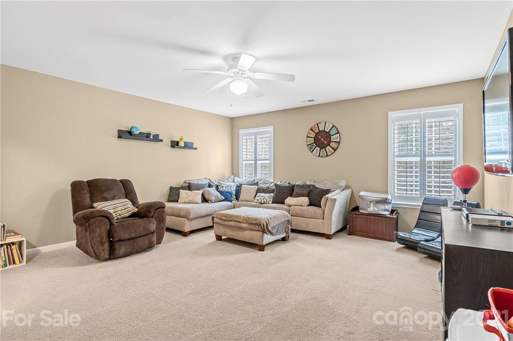 88 Roanoke Road Fletcher, NC 28732 - Photo 22 of 34 a living room with furniture and a window