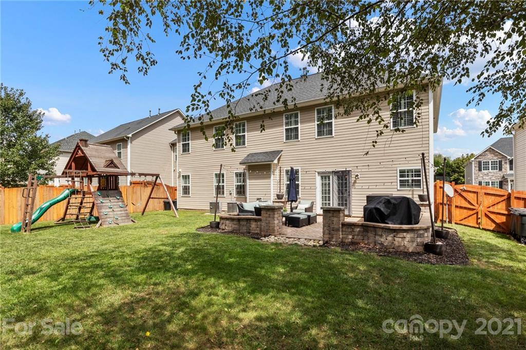 88 Roanoke Road Fletcher, NC 28732 - Photo 5 of 34 a view of a house with backyard porch and sitting area