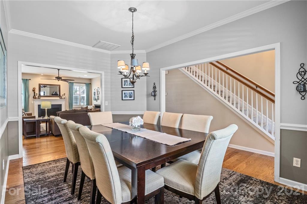 88 Roanoke Road Fletcher, NC 28732 - Photo 7 of 34 a view of a dining room with furniture wooden floor and a chandelier