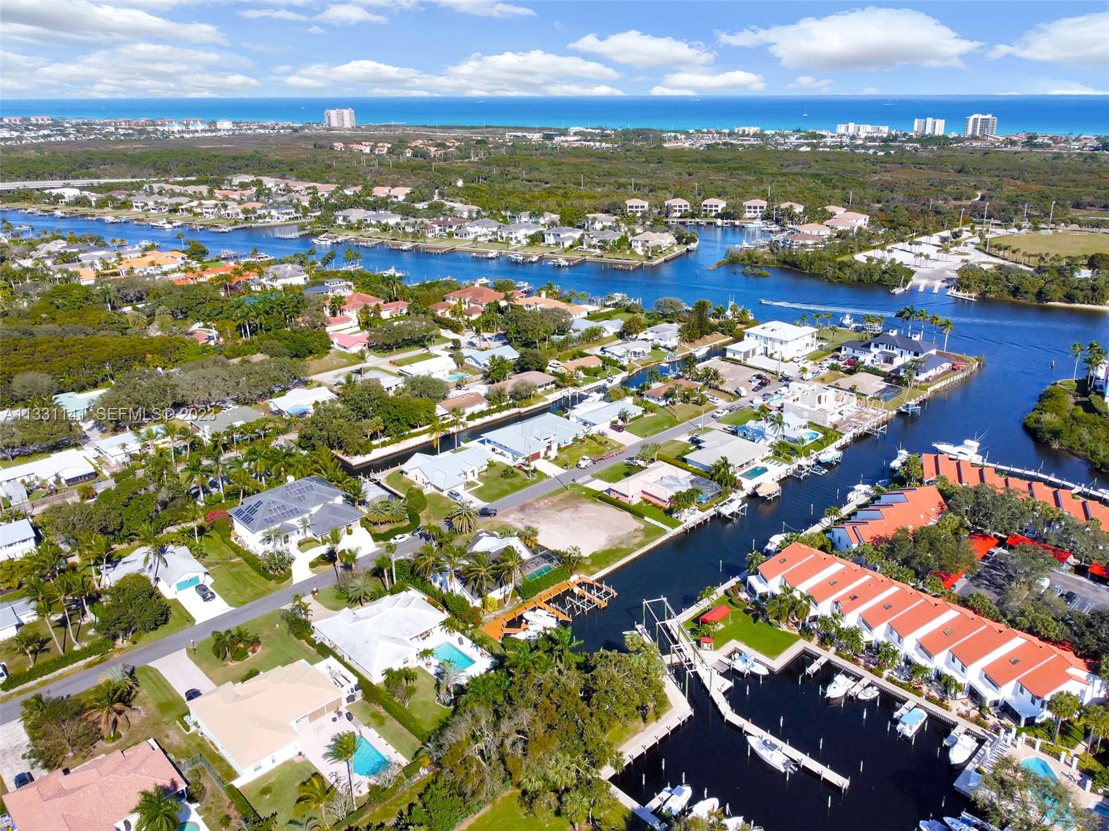 2400 Edward Road Palm Beach Gardens, FL 33410 - Photo 14 of 49 an aerial view of residential houses with outdoor space