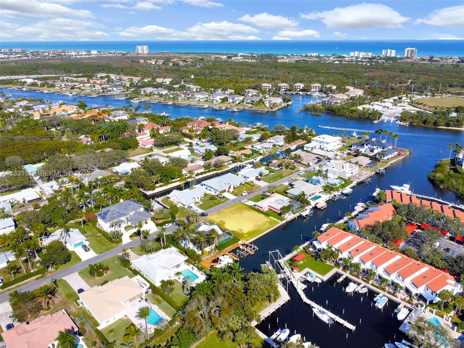 2400 Edward Road Palm Beach Gardens, FL 33410 - Photo 15 of 49 an aerial view of residential houses with outdoor space