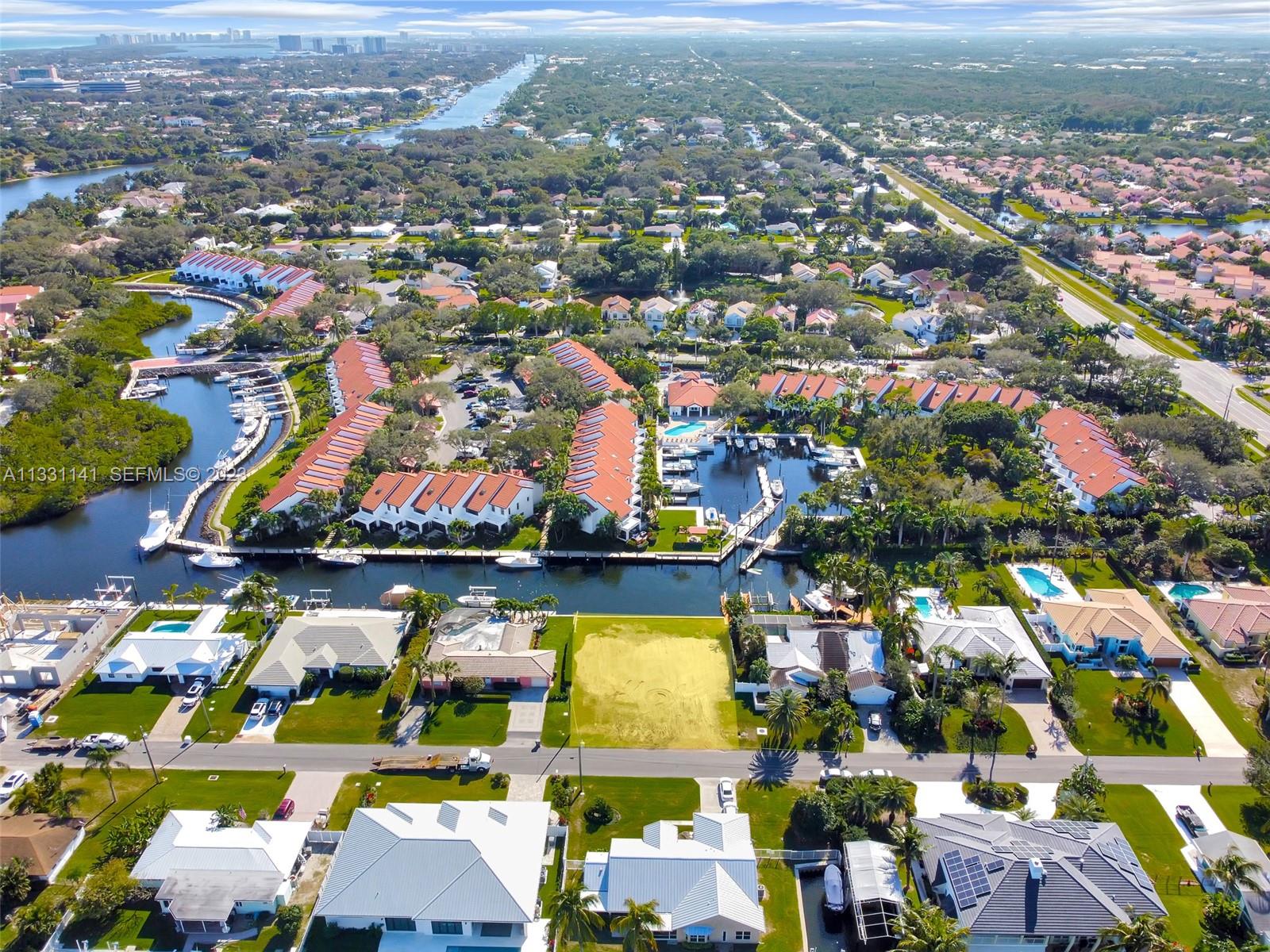 2400 Edward Road Palm Beach Gardens, FL 33410 - Photo 21 of 49 an aerial view of a houses with a swimming pool