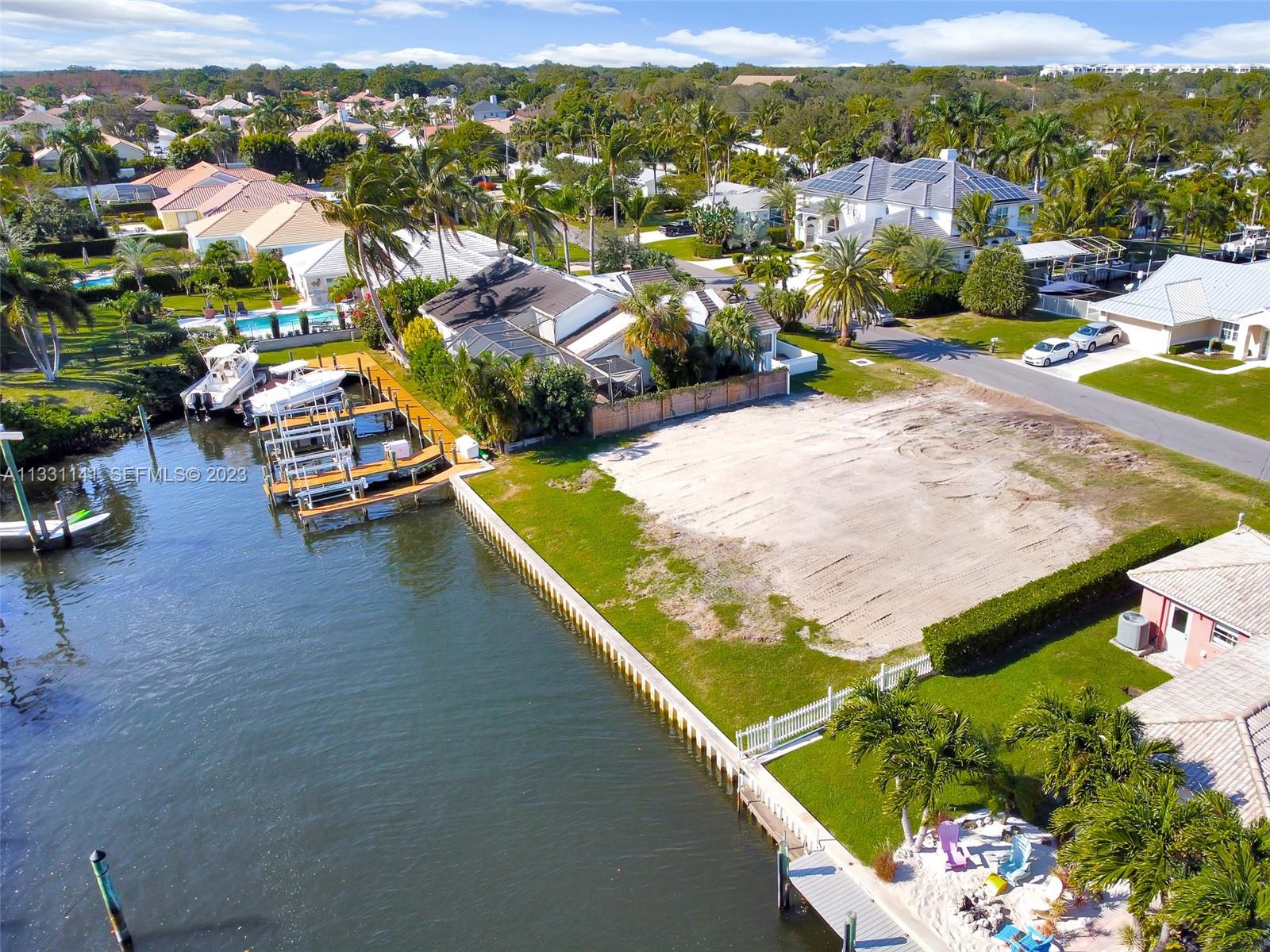 2400 Edward Road Palm Beach Gardens, FL 33410 - Photo 31 of 49 an aerial view of a house with a swimming pool yard and outdoor seating