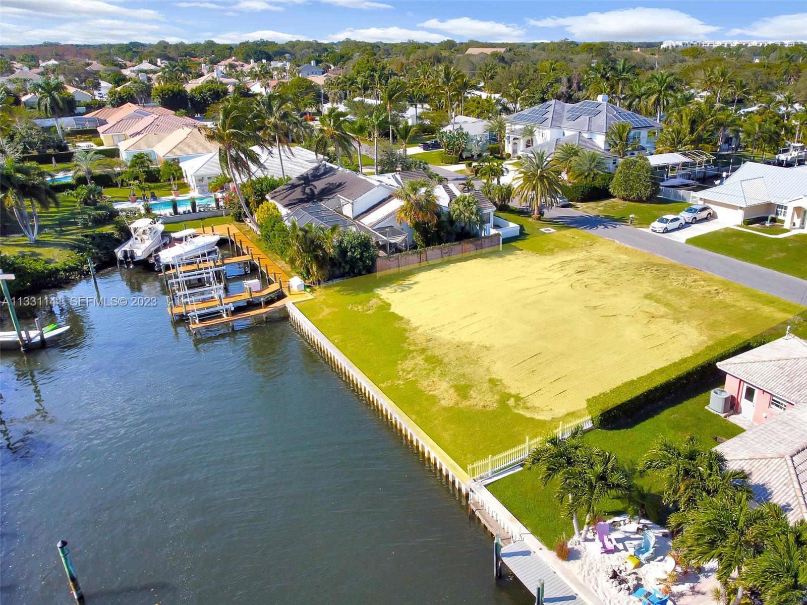 2400 Edward Road Palm Beach Gardens, FL 33410 - Photo 32 of 49 an aerial view of a swimming pool with lawn chairs