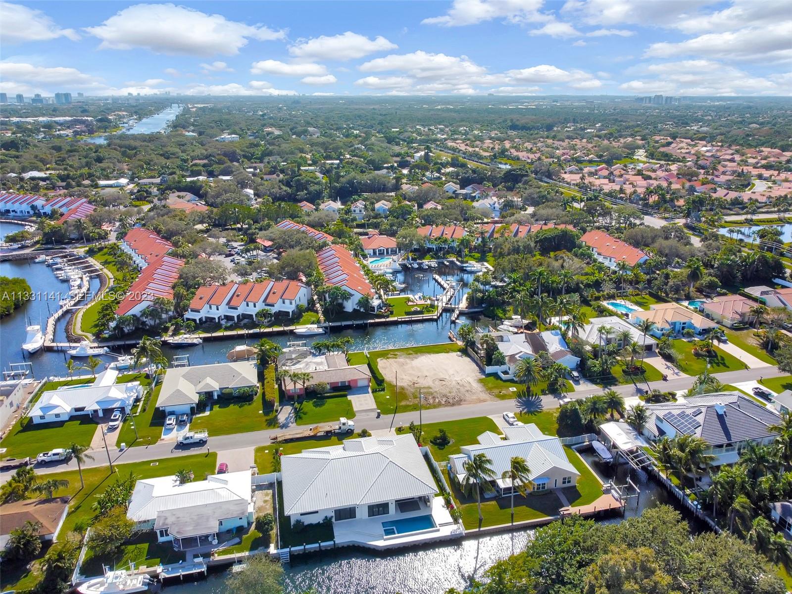 2400 Edward Road Palm Beach Gardens, FL 33410 - Photo 4 of 49 an aerial view of a houses with a swimming pool