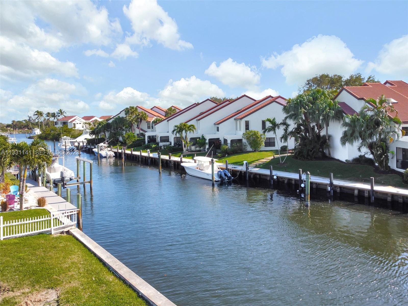 2400 Edward Road Palm Beach Gardens, FL 33410 - Photo 42 of 49 a view of a lake with a house