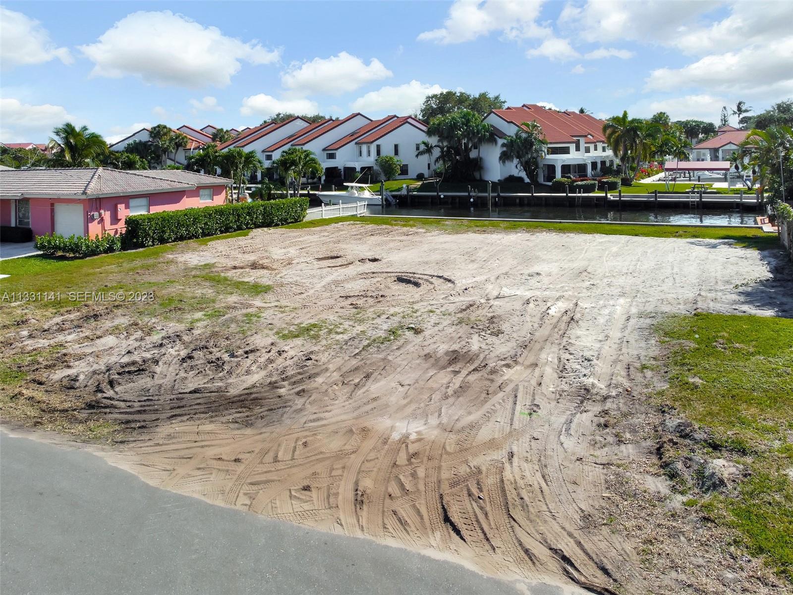 2400 Edward Road Palm Beach Gardens, FL 33410 - Photo 44 of 49 a view of a lake with houses