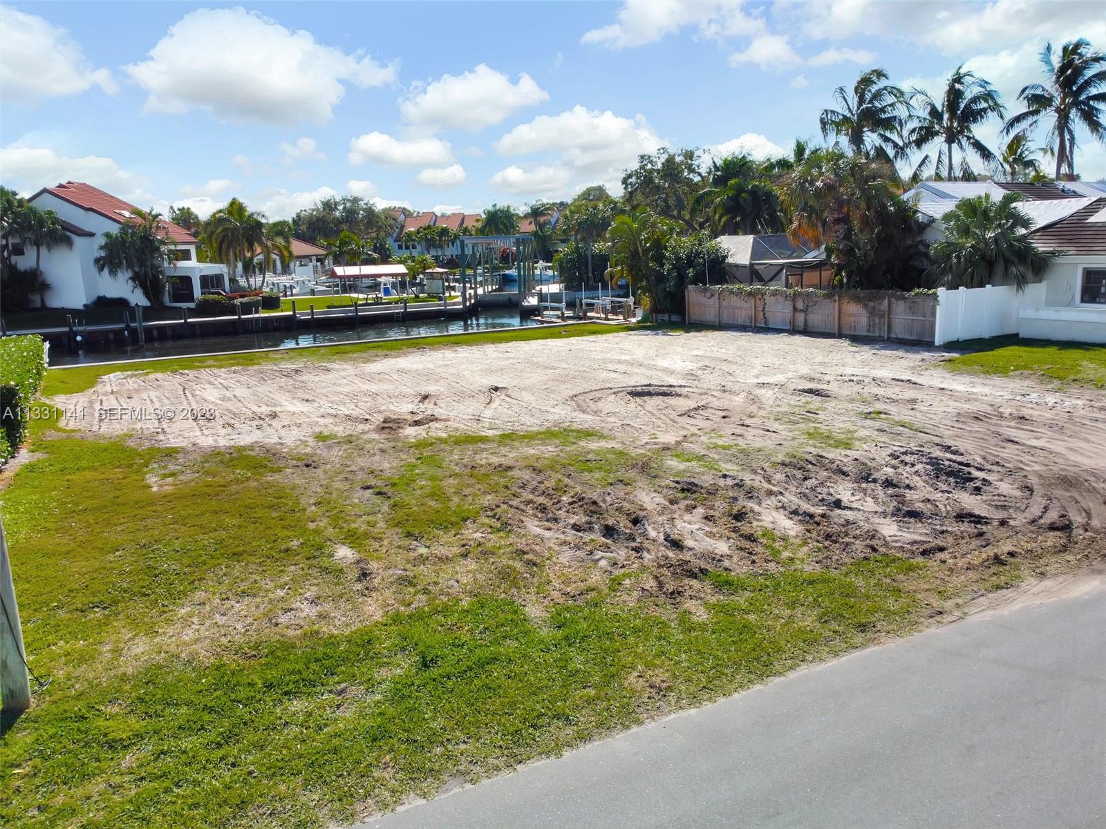 2400 Edward Road Palm Beach Gardens, FL 33410 - Photo 45 of 49 a view of a swimming pool with an outdoor seating and a lake view