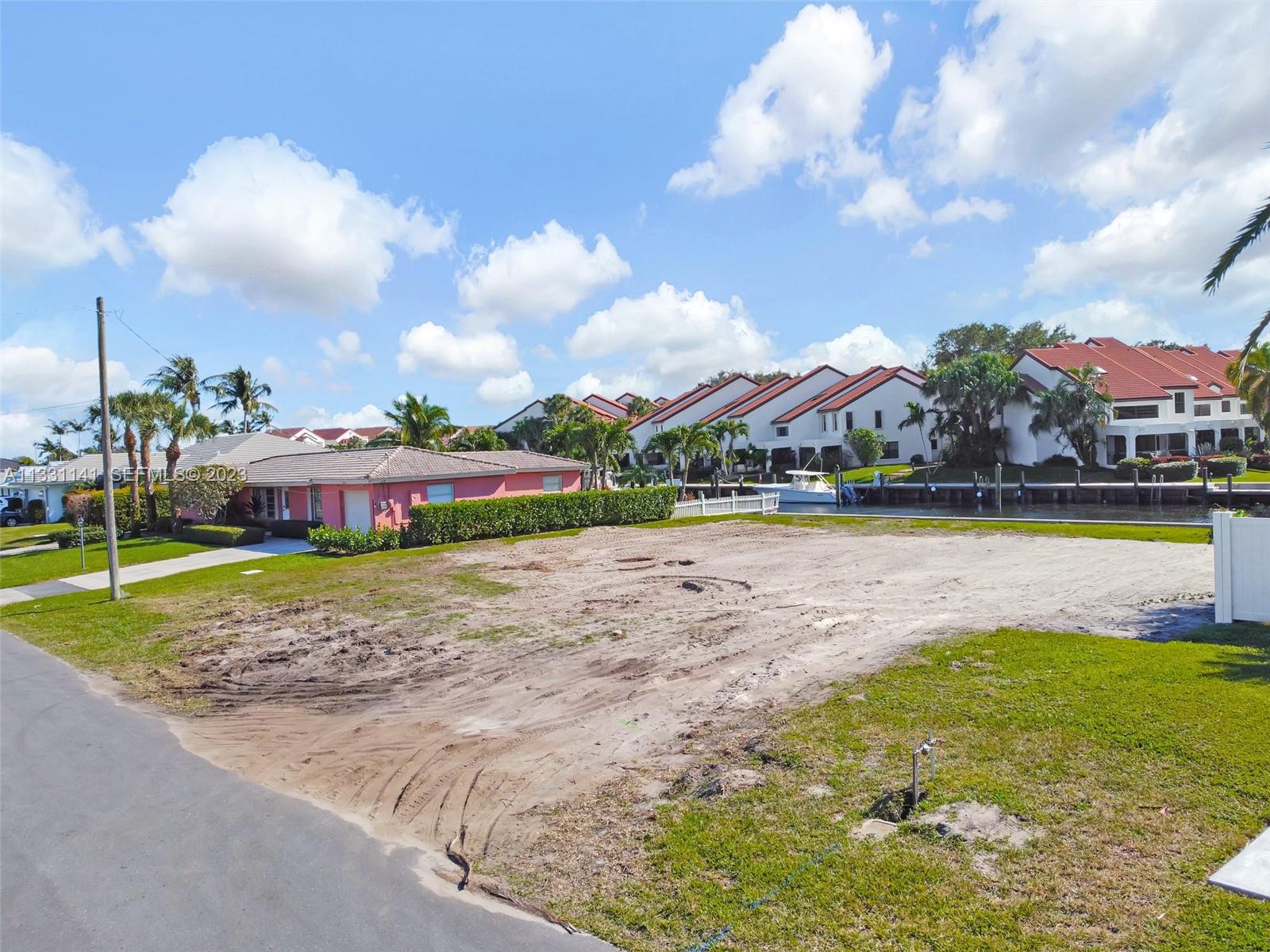 2400 Edward Road Palm Beach Gardens, FL 33410 - Photo 47 of 49 a view of a house with swimming pool and yard