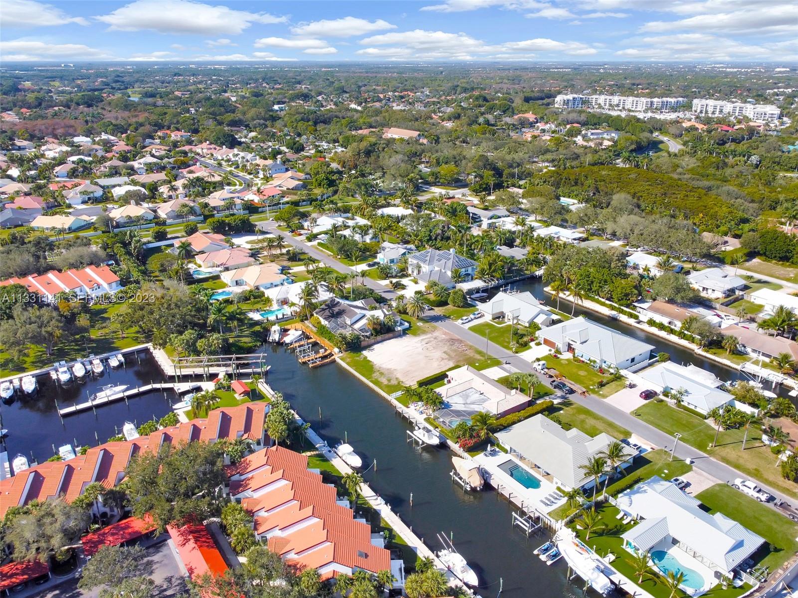 2400 Edward Road Palm Beach Gardens, FL 33410 - Photo 8 of 49 an aerial view of residential houses with outdoor space