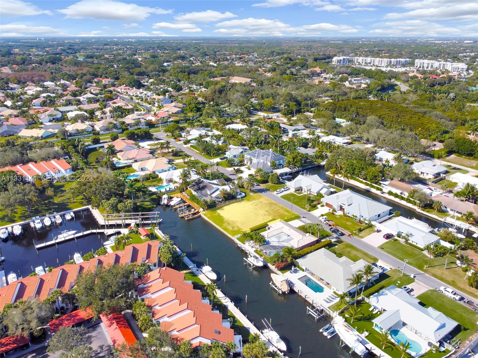 2400 Edward Road Palm Beach Gardens, FL 33410 - Photo 9 of 49 an aerial view of residential houses with outdoor space