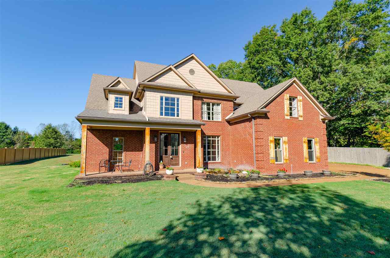 9487 Osborn Road Arlington, TN 38002 - Photo 1 of 23 a front view of a house with a yard